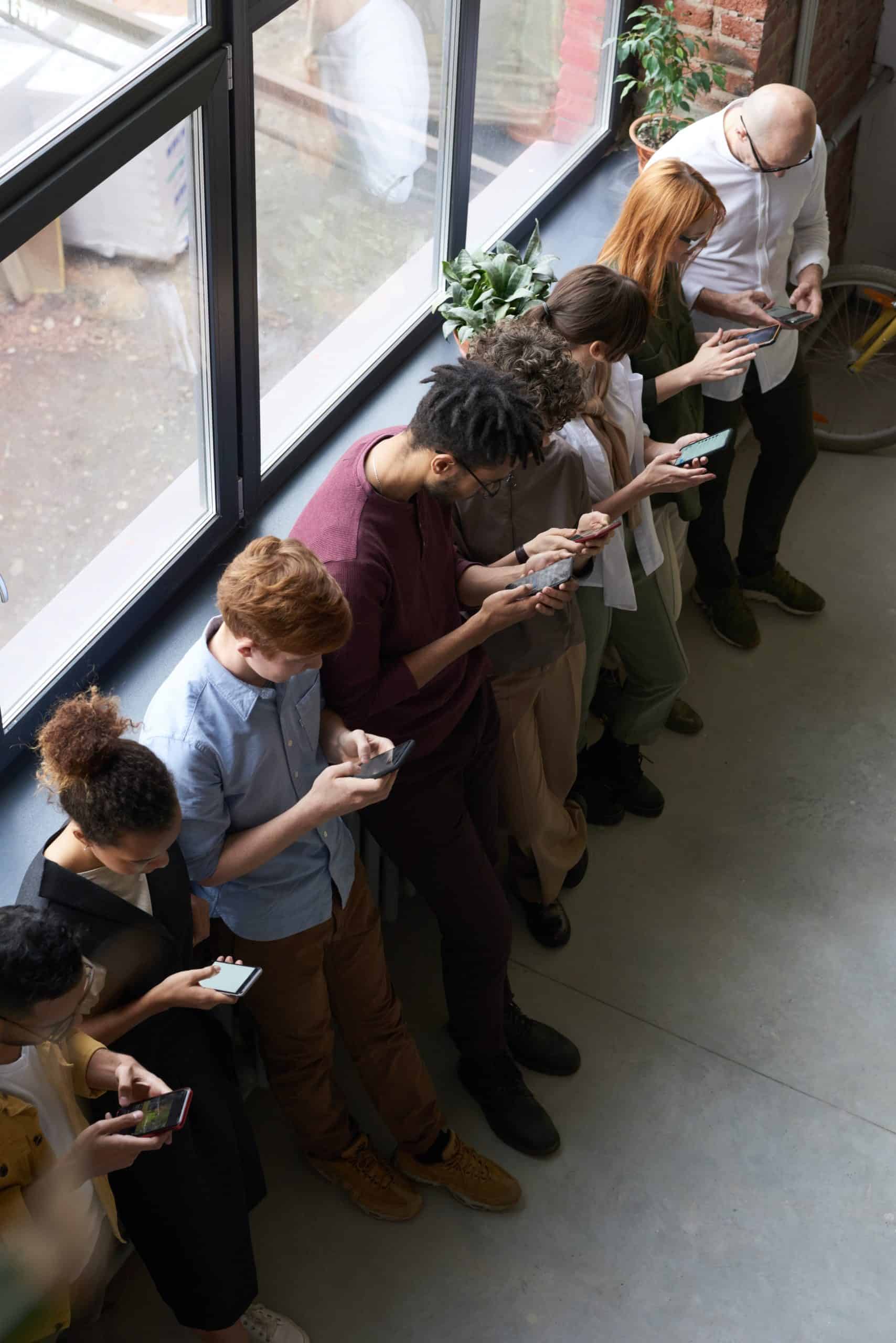 people looking down on their phones